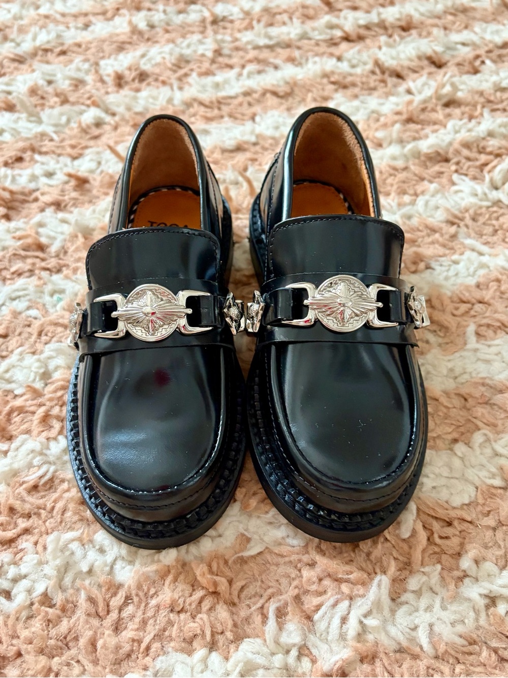 Toga Pulla Black Leather Loafers with Silver Medallion Hardware